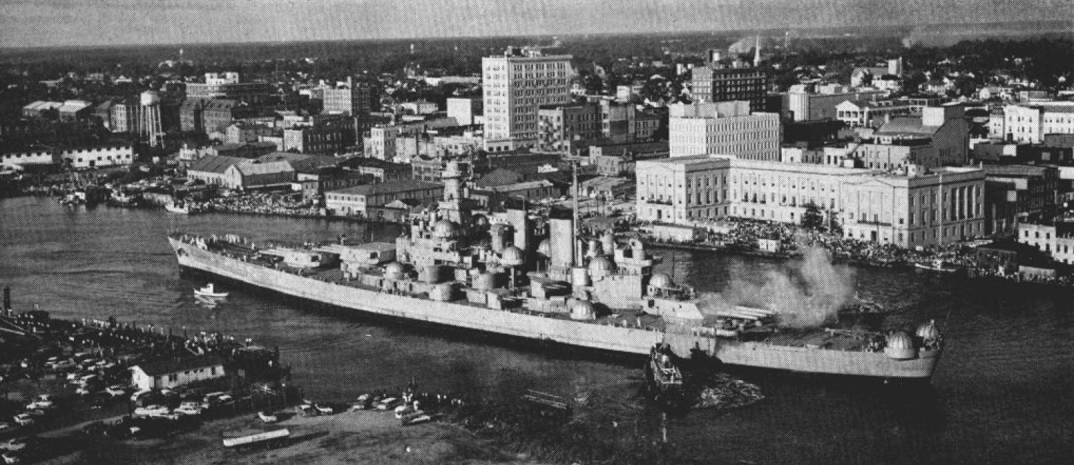 Tugs towing the battleship North Carolina to Wilmington in 1961