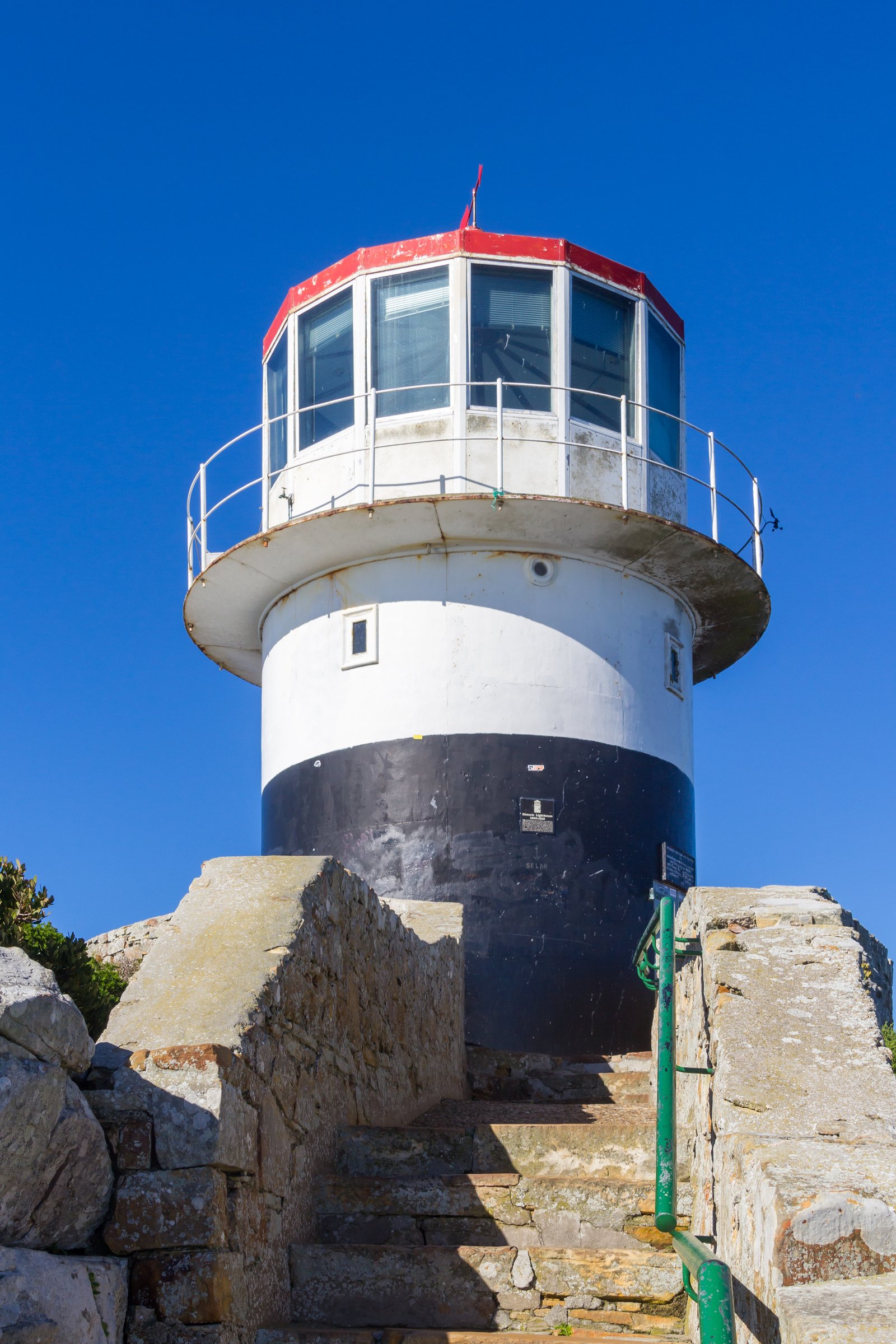 Cliffs and lighthouse at Cape Point above the sea south of Cape Town