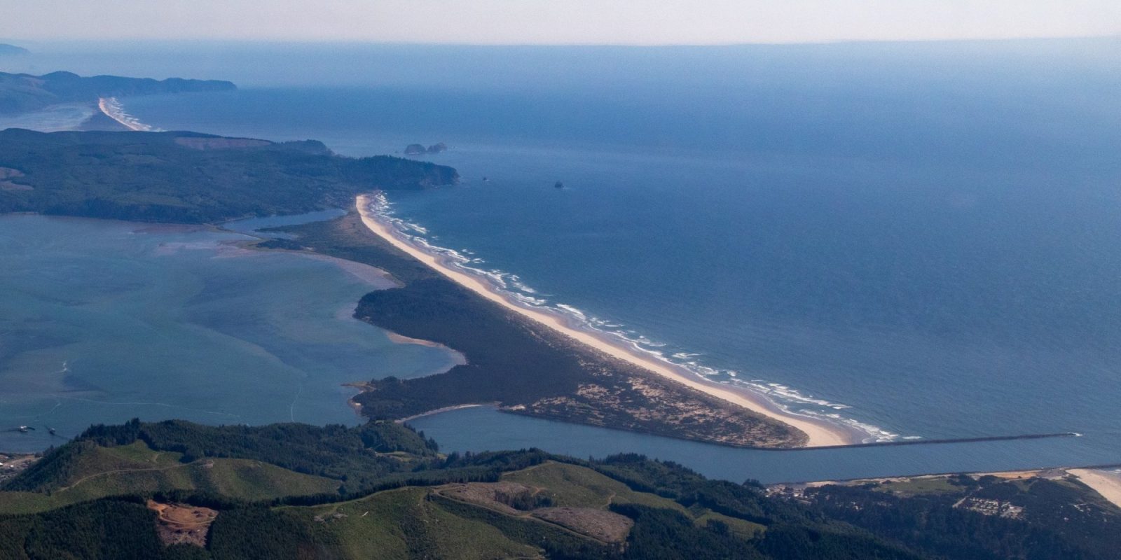 Aerial view of the Bayocean Peninsula, the narrow sand spit between Tillamook Bay and the Pacific Ocean