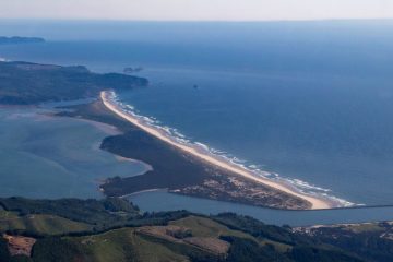 Aerial view of the Bayocean Peninsula, the narrow sand spit between Tillamook Bay and the Pacific Ocean